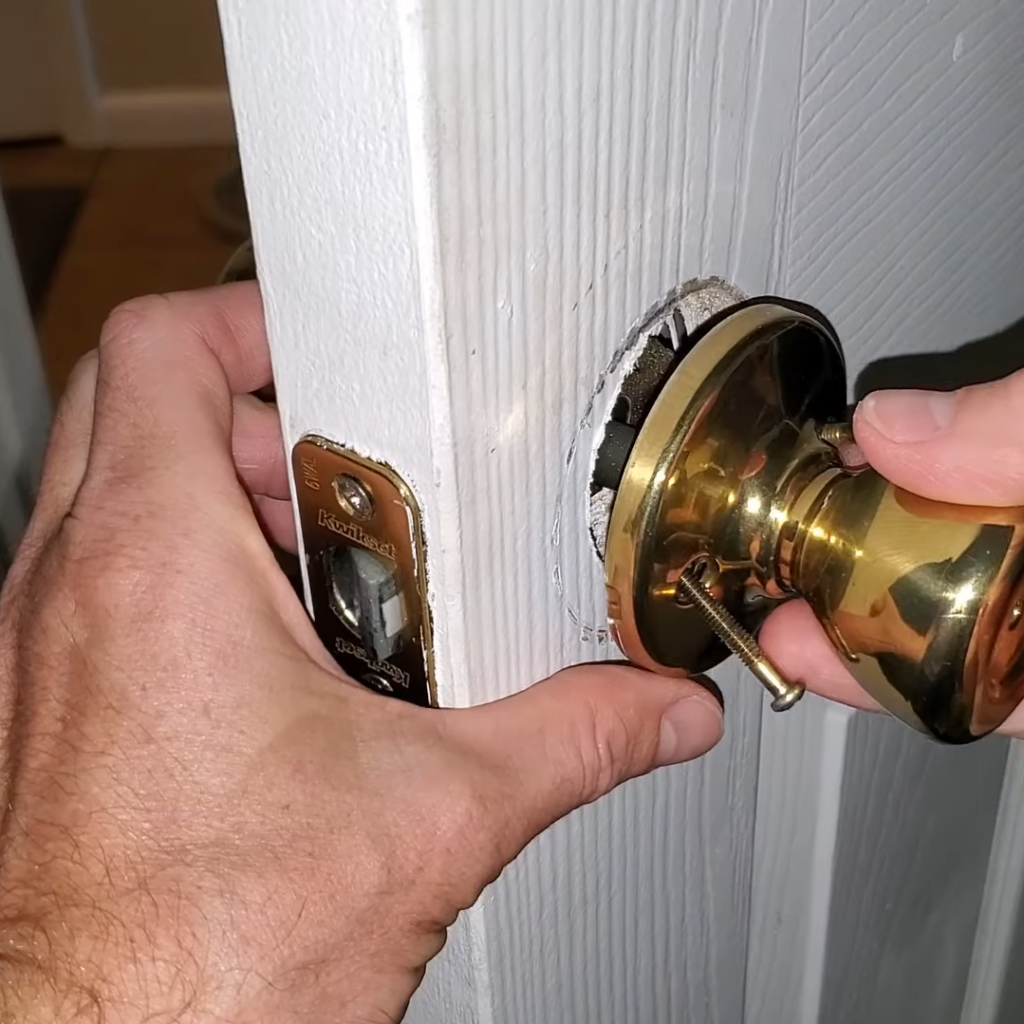 Door latch being replaced and fixed