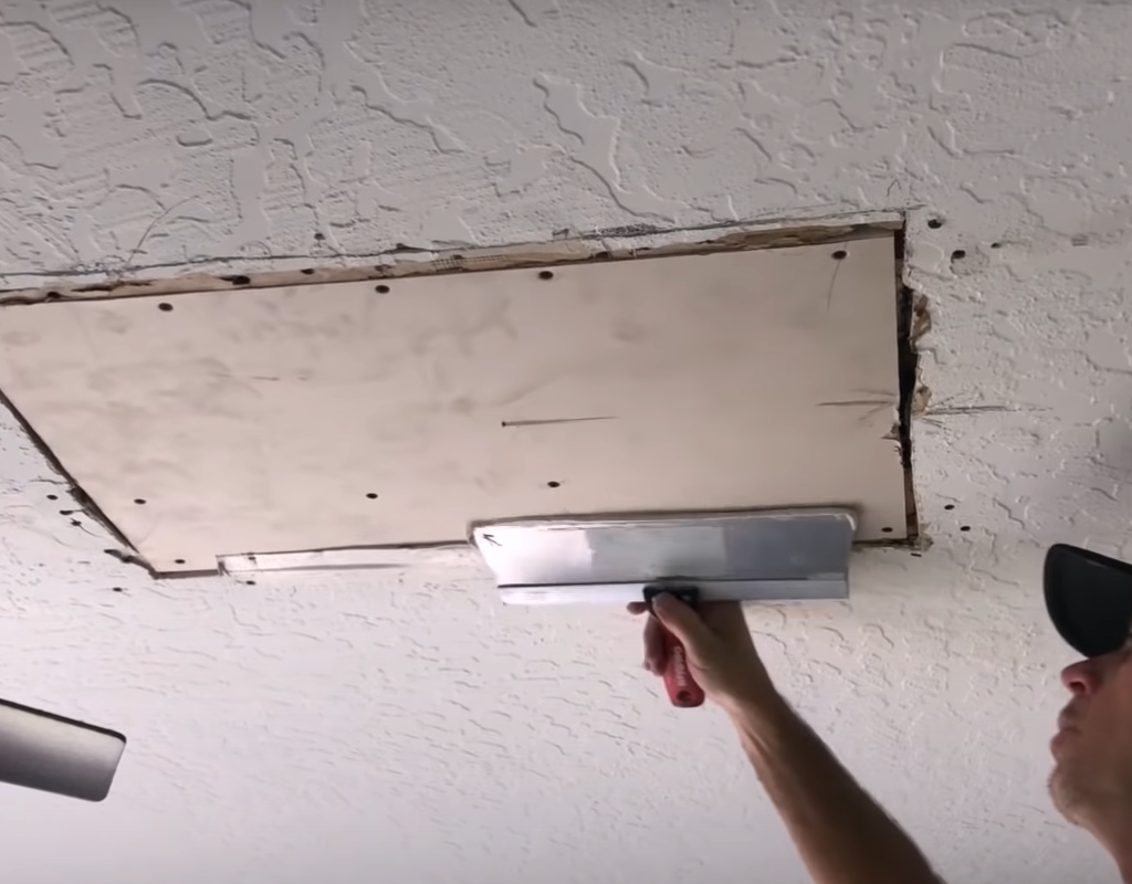 Applying drywall tape