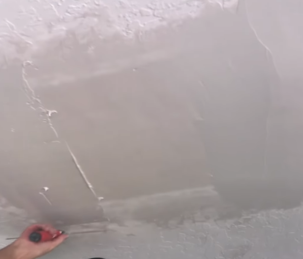 Skim coat ceiling repair