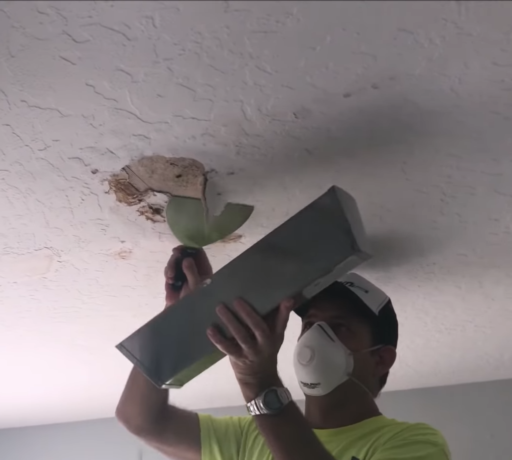 Picking away at ceiling