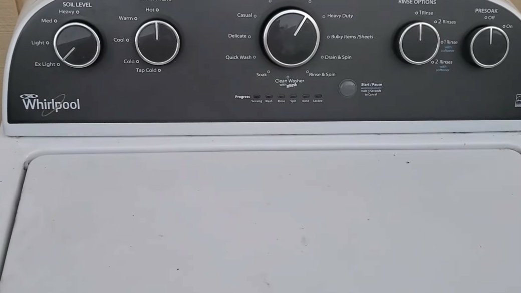 The top of a white Whirlpool washing machine