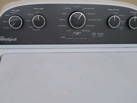 The top of a white Whirlpool washing machine