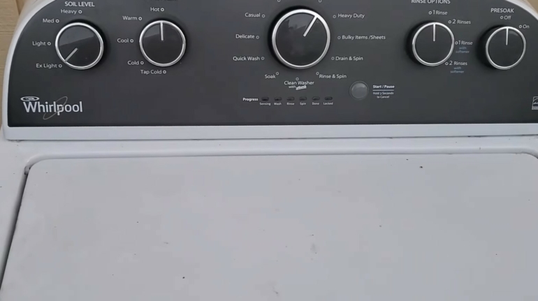 The top of a white Whirlpool washing machine
